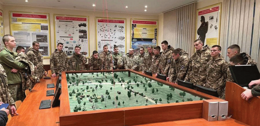 An example of a teacher conducting a professional and business game with cadets in their roles as officers.